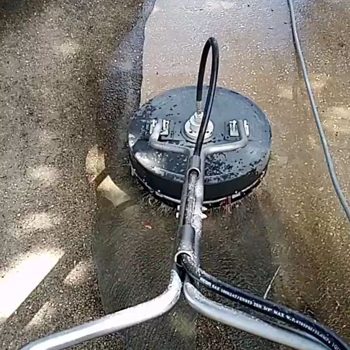 Surface cleaner working on stained concrete